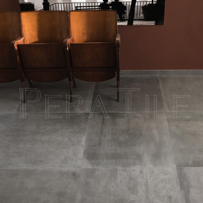 Urbana 24x24 Grigio concrete-look porcelain floor with vintage theater seats