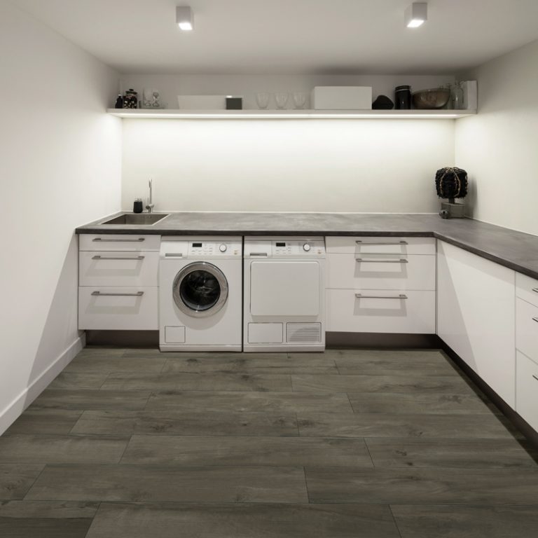 Laundry room with a Colville 8x48 Smoke wood-look porcelain tile floor