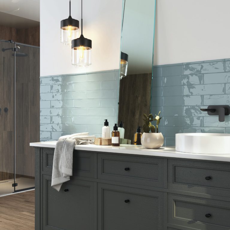 Bathroom with Ravello 3x12 Sky blue glossy wall tile above a dark vanity