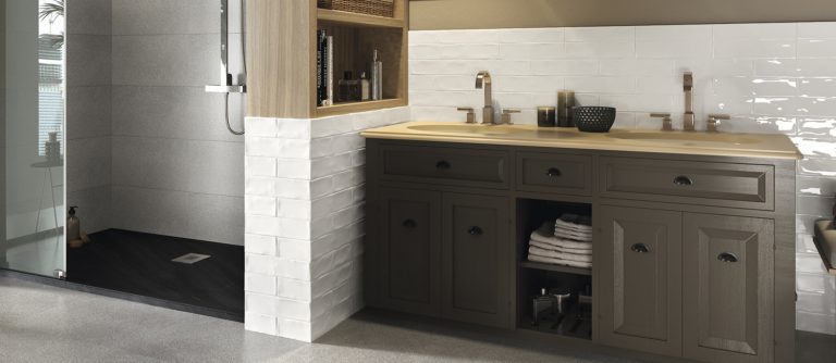 Bathroom with Ravello 3x12 White glossy wall tile beside a dark double vanity