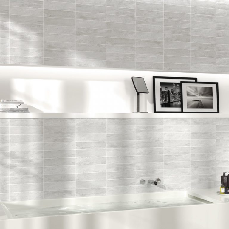 Bathroom wall in Verona 3x12 Gray marble-look tile above a white tub