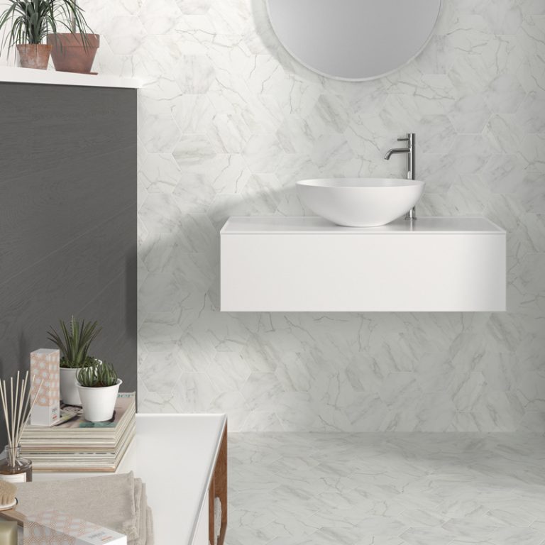 Bathroom with Verona 5-1/2x6-3/8 White marble-look hexagon tile on the wall and floor and a floating sink