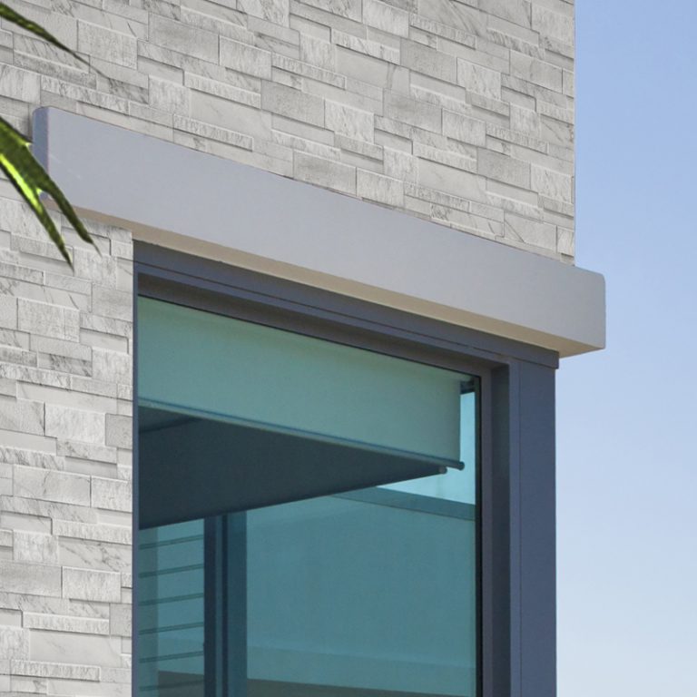 House exterior corner clad in Marmi White marble-look interlocking porcelain wall panels with an outside mitered corner