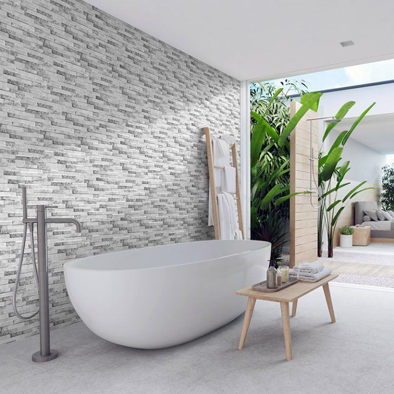 Bathroom with a Natura Artico interlocking porcelain wall panel feature wall and a freestanding tub