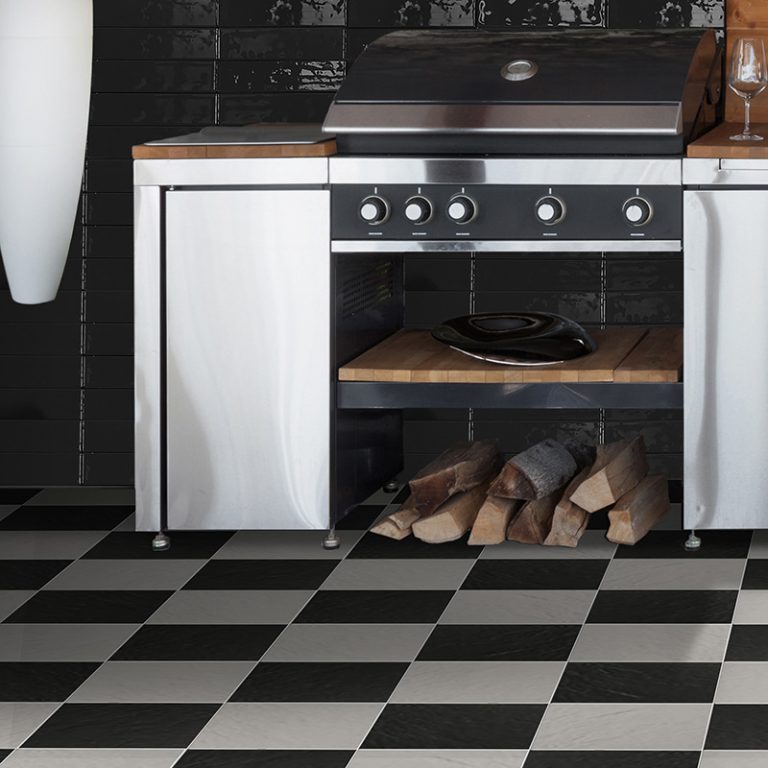 Kitchen with a Colors Greige and Black 9-7/8x9-7/8 checkerboard floor and a Black brick tile backsplash