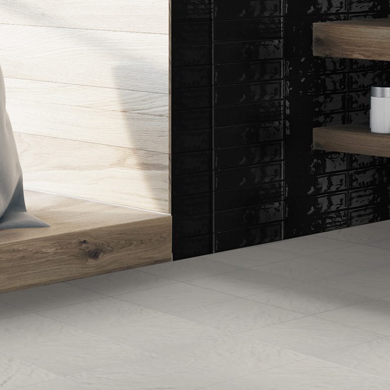 Bathroom with a Colors 9-7/8x9-7/8 Greige porcelain floor and a Colors Black brick tile wall