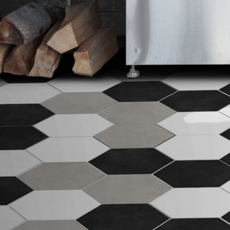 Colors black, white and greige hexagon tile floor with stacked firewood