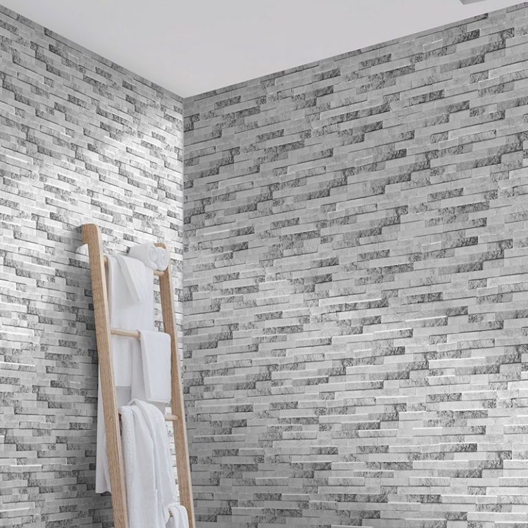 Bathroom corner in Natura Artico stone-look interlocking porcelain wall panels with a wood towel ladder