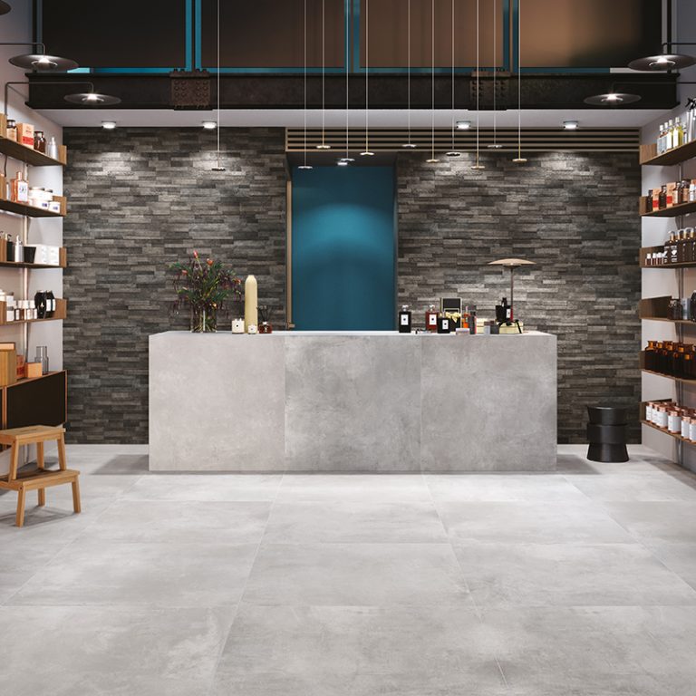 Wine shop with Volcano 6x24 Dark cement-look wall panels behind a stone counter