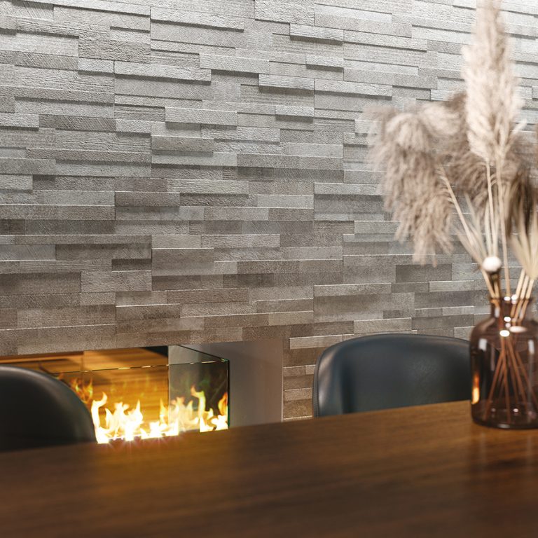 Fireplace wall in Volcano 6x24 Gray cement-look wall panels with dried pampas grass