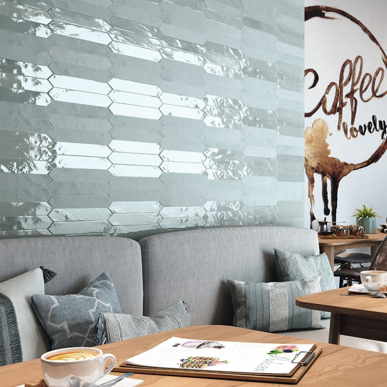Coffee shop wall in Switch 2x10 Blue glossy picket tile above banquette seating