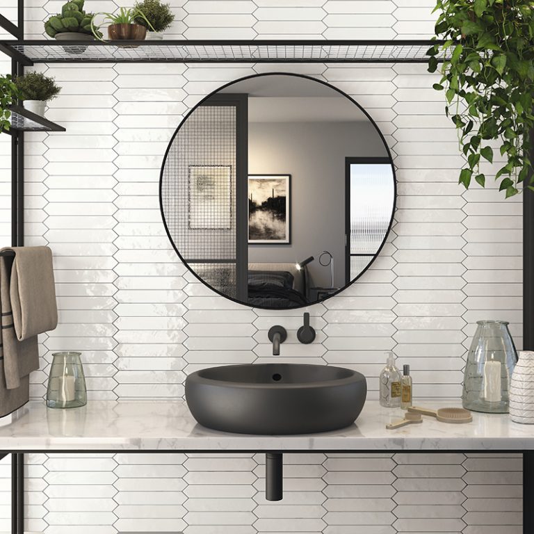 Bathroom with Switch 2x10 White glossy picket wall tile, a round mirror and a black vessel sink