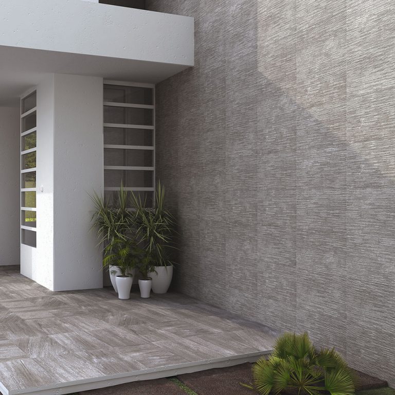 House entry with Ontario 12x22 Antracita raked stone-look wall panels on the exterior walls