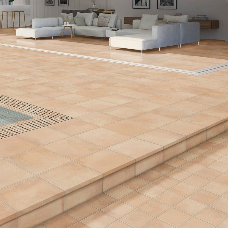 Pool deck in Memory 7x7 and 14x14 Sandy porcelain tile with matching monoblock pool coping