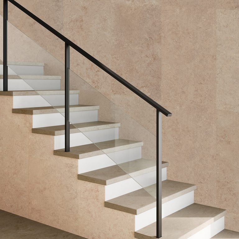Staircase and wall in Upstone 24x48 Jura Beige stone-look porcelain tile