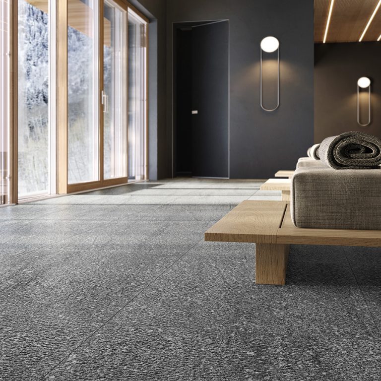 Living room with an Upstone 24x48 London Grigio stone-look porcelain tile floor