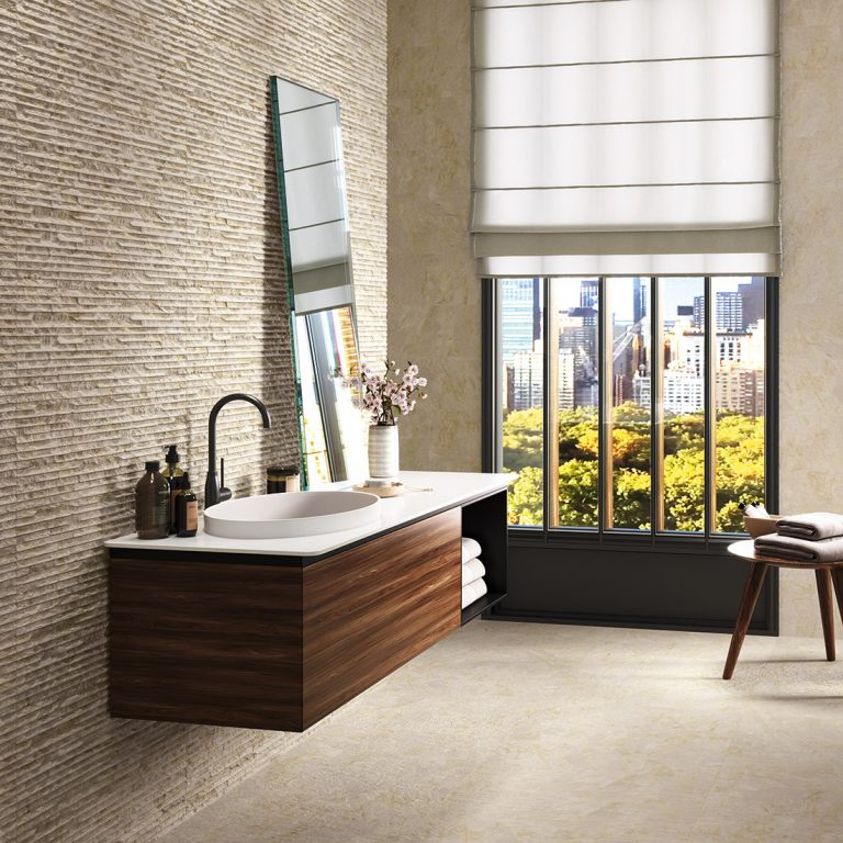 Bathroom with an Iguazu 8x25 Sand raked stone-look wall panel accent wall and a floating vanity