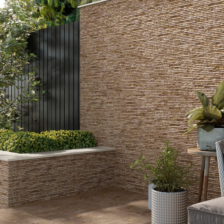 Garden wall and planter clad in Iguazu 8x25 Terra raked stone-look wall panels with mitered corners