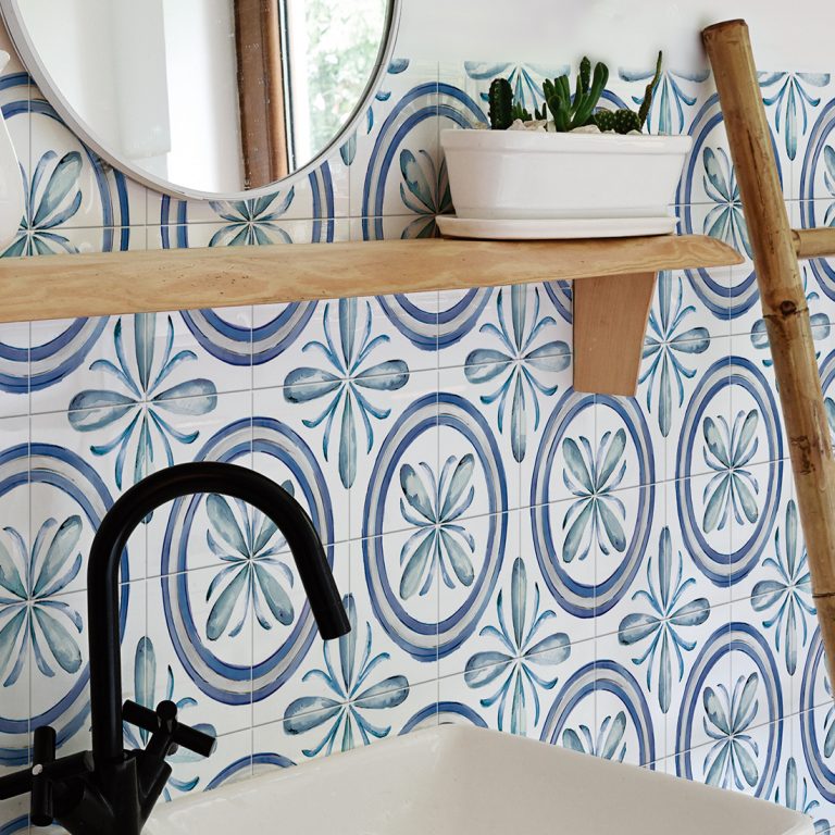 Saint Germain 6x6 Rivette patterned porcelain wall tile behind a black faucet and wood shelf