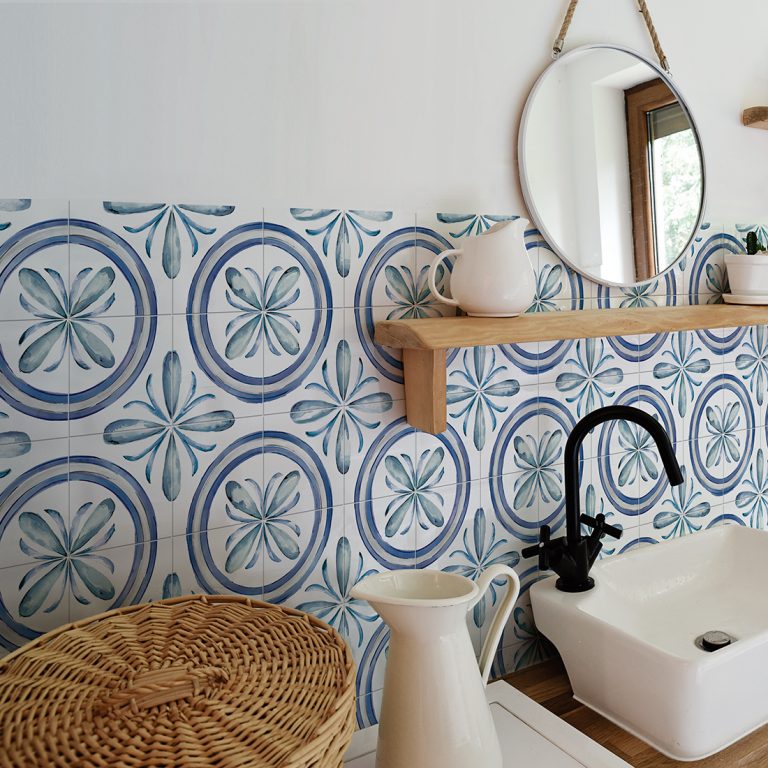Bathroom with Saint Germain 6x6 Rivette blue and white patterned porcelain wall tile and a round mirror