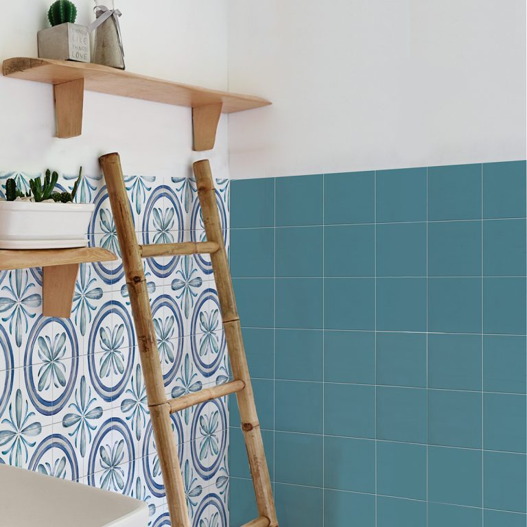 Bathroom wall with Saint Germain 6x6 Turquoise porcelain tile beside Saint Germain Rivette patterned tile
