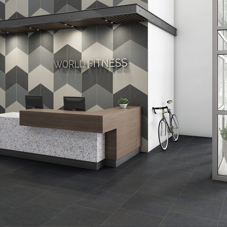 Fitness reception area with a Eureka 12x24 Dark Gray porcelain tile floor