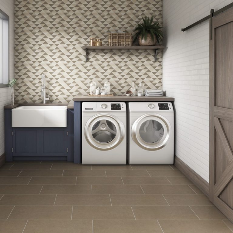 Laundry room with a Eureka 12x24 Tobacco porcelain tile floor and a farmhouse sink