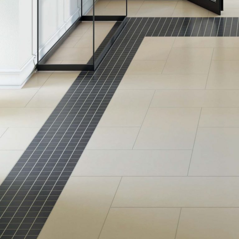 Eureka 12x24 White porcelain floor tile with a Eureka Dark Gray 2x2 mosaic border