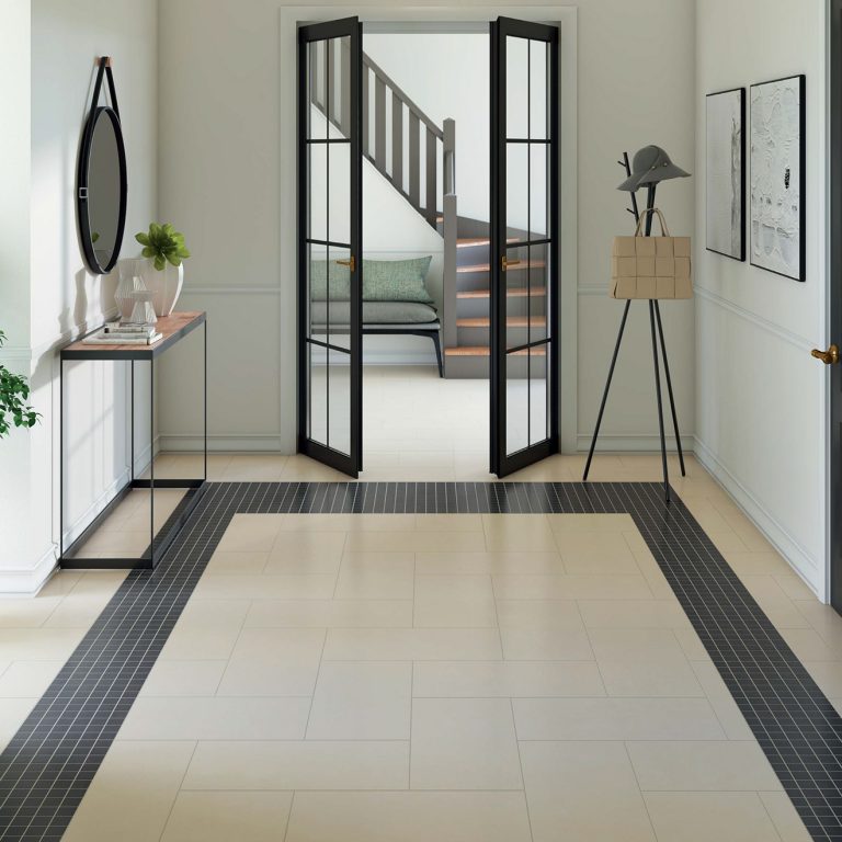 Entry hall with a Eureka 12x24 White porcelain floor bordered by Eureka Dark Gray 2x2 mosaic