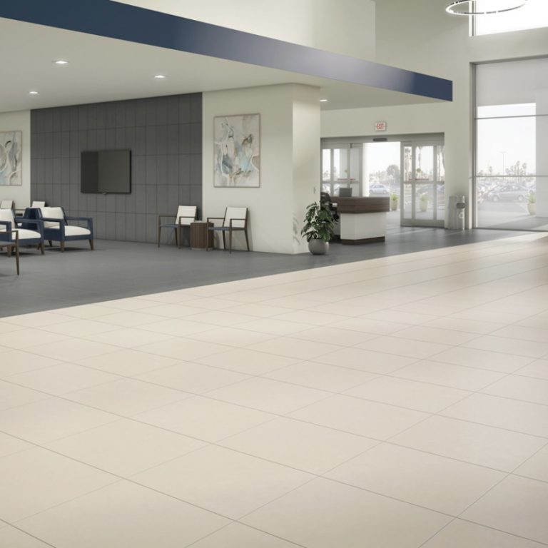 Lobby with a Eureka 12x24 White porcelain tile floor and a Eureka Dark Gray border