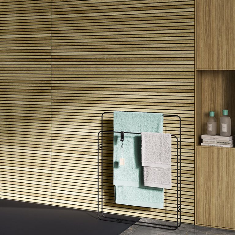 Bathroom wall in Baywood Hermosa 24x48 Natural wood-look porcelain tile with a towel rack and niche