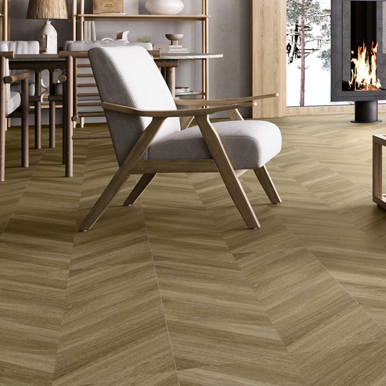 Living room with a Baywood Manhattan 24x48 Natural wood-look porcelain floor in a chevron pattern