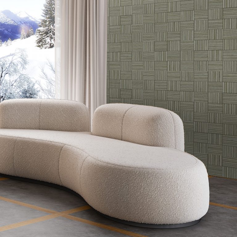 Baywood Redondo 24x48 Silver wood-look porcelain tile in a parquet pattern behind a curved sofa