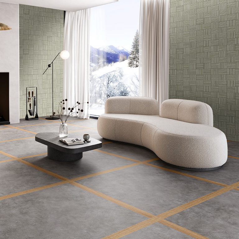 Living room with a Baywood Redondo Silver parquet-pattern porcelain wall and a curved sofa