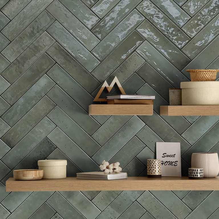 Kitchen wall in Posh 2-3/8x9-7/8 green glossy brick tile in a herringbone pattern with floating shelves