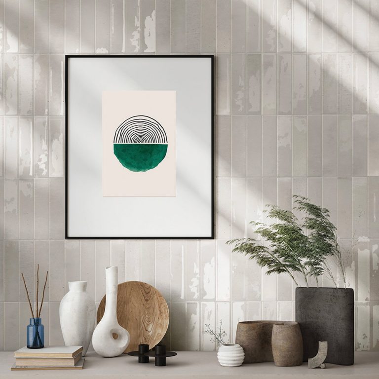 Living room wall in Posh 2-3/8x9-7/8 ivory glossy brick tile with framed art and pottery