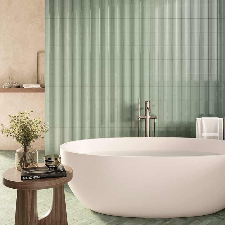 Bathroom with a Refined Stripes 3D green 2x6 tile wall behind a freestanding tub