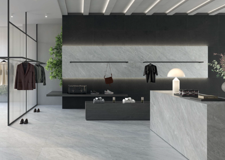 Clothing boutique with Pietrasanta Bianco 24x48 marble-look porcelain tile on the floor, wall and counter