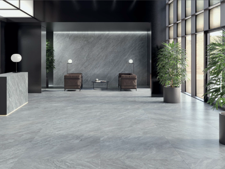 Office lobby with Pietrasanta Grigio 24x48 marble-look porcelain tile on the floor and feature wall