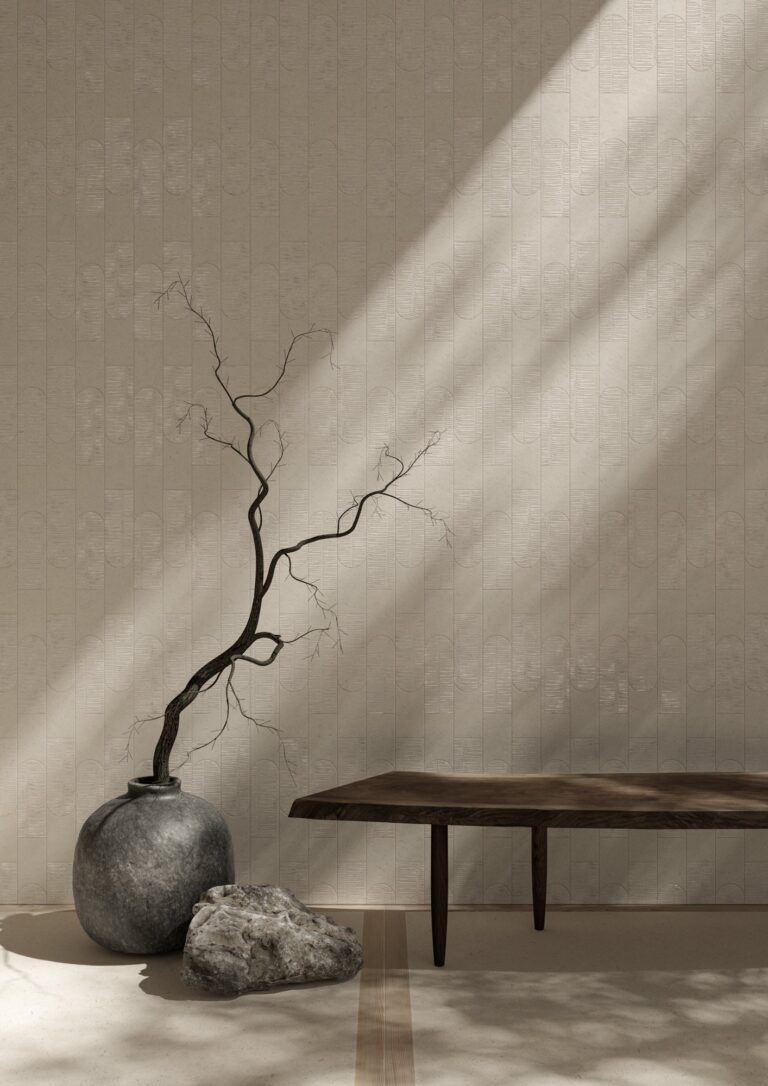 Impression Bamboo Bone 24x48 porcelain wall tile with a low bench and a branch in a vase