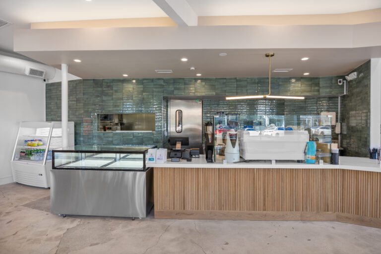 Cafe counter with green Posh brick tile backsplash