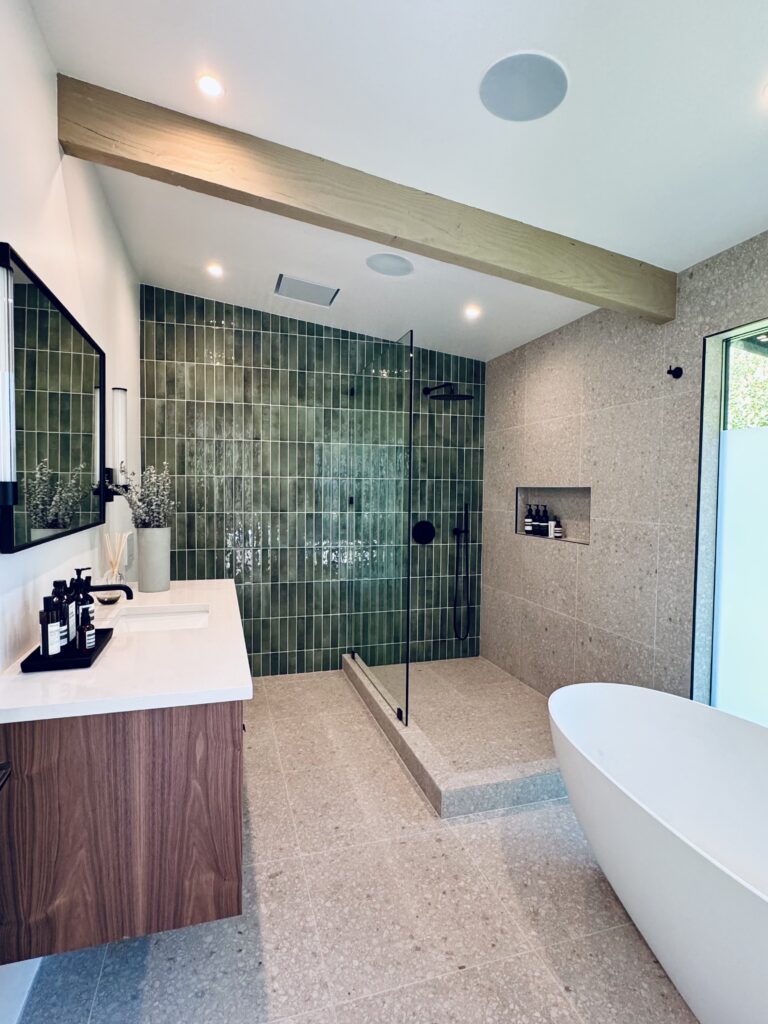 Bathroom with walk-in shower and freestanding tub, green Posh 2-3/8x9-7/8 brick tile on the shower wall