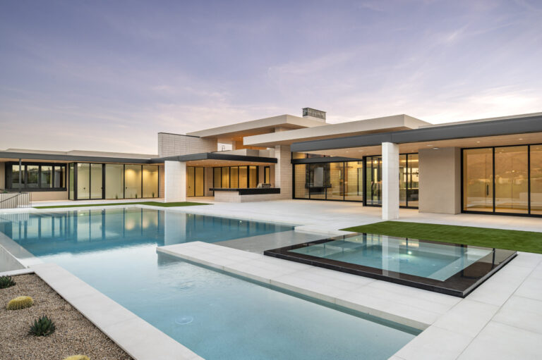 Arizona home by Parolo Builders with a pool and spa surrounded by Silky Stone Light porcelain pavers